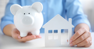 Mobile home financing - Piggy bank with a miniature house